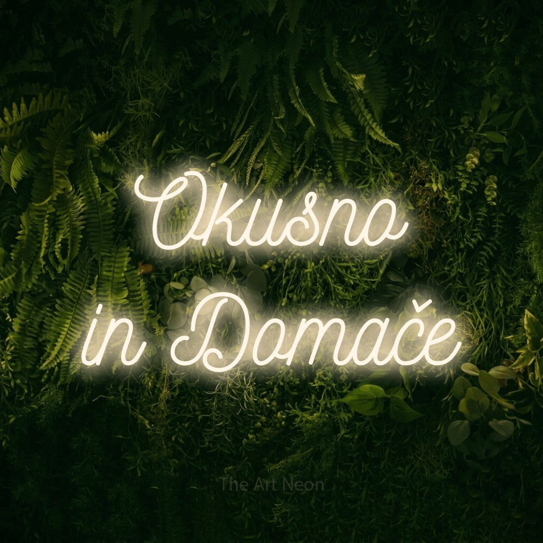 LED neon sign reading “Okusno in Domače”, arranged in two lines.