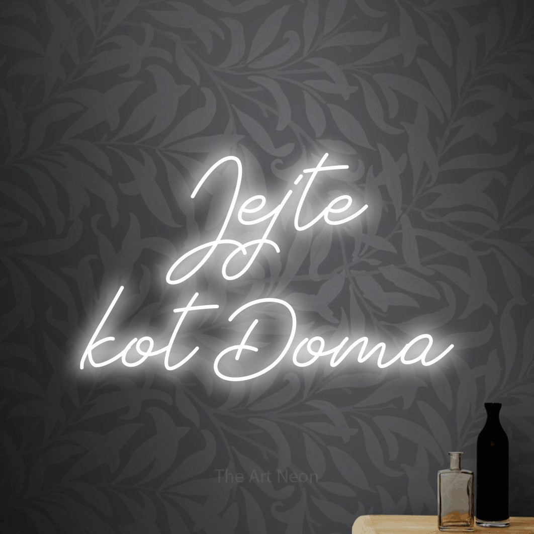 LED neon sign reading “Jejte kot Doma”, arranged in two lines.