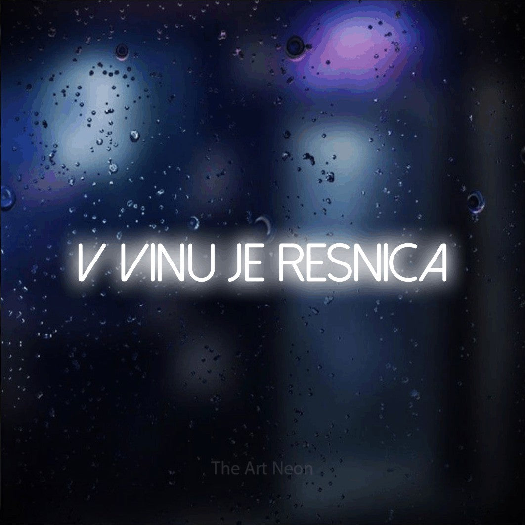 LED neon sign reading “V Vinu je RESNICA”, arranged in a single line.
