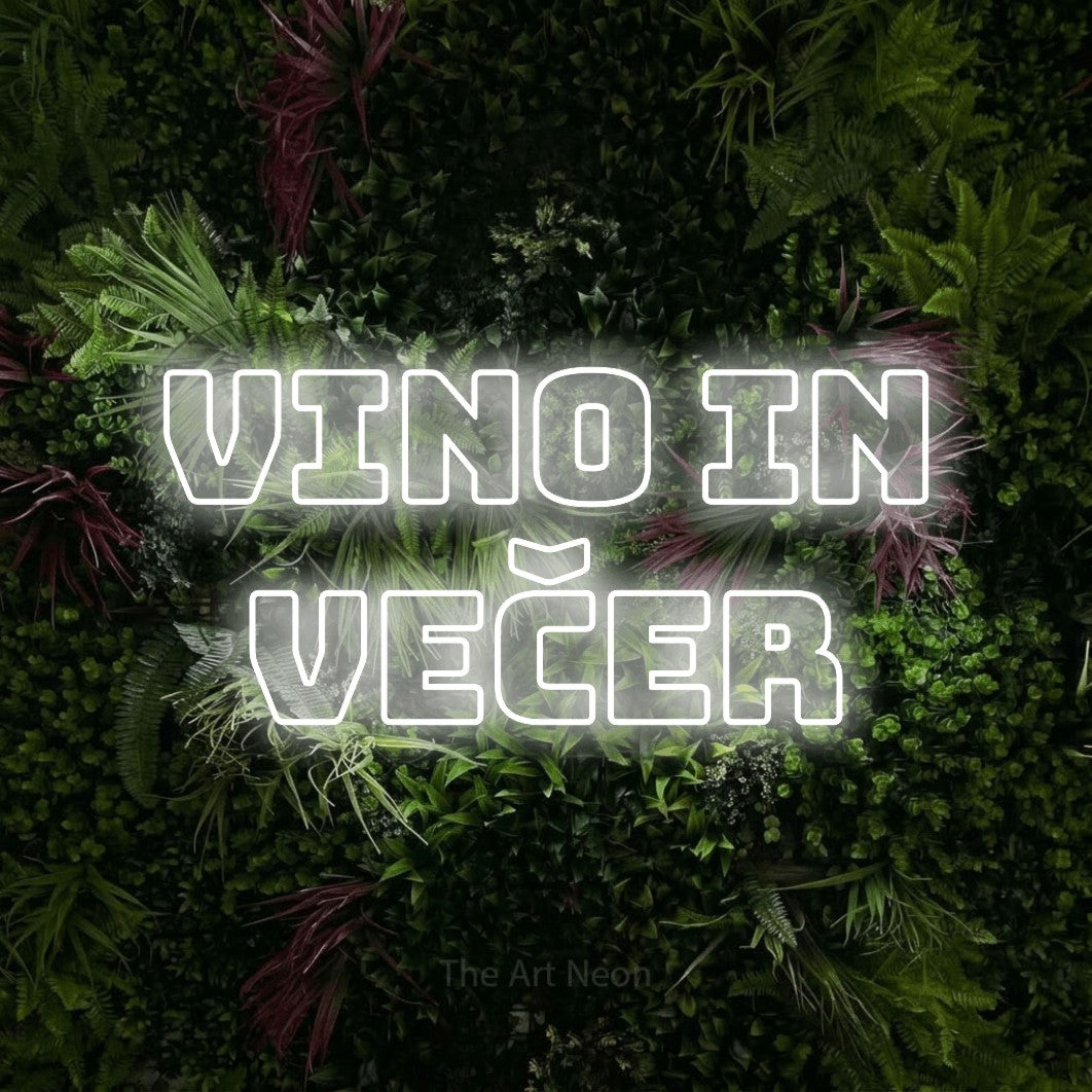 LED neon sign reading “Vino in VEČER”, arranged in two lines.