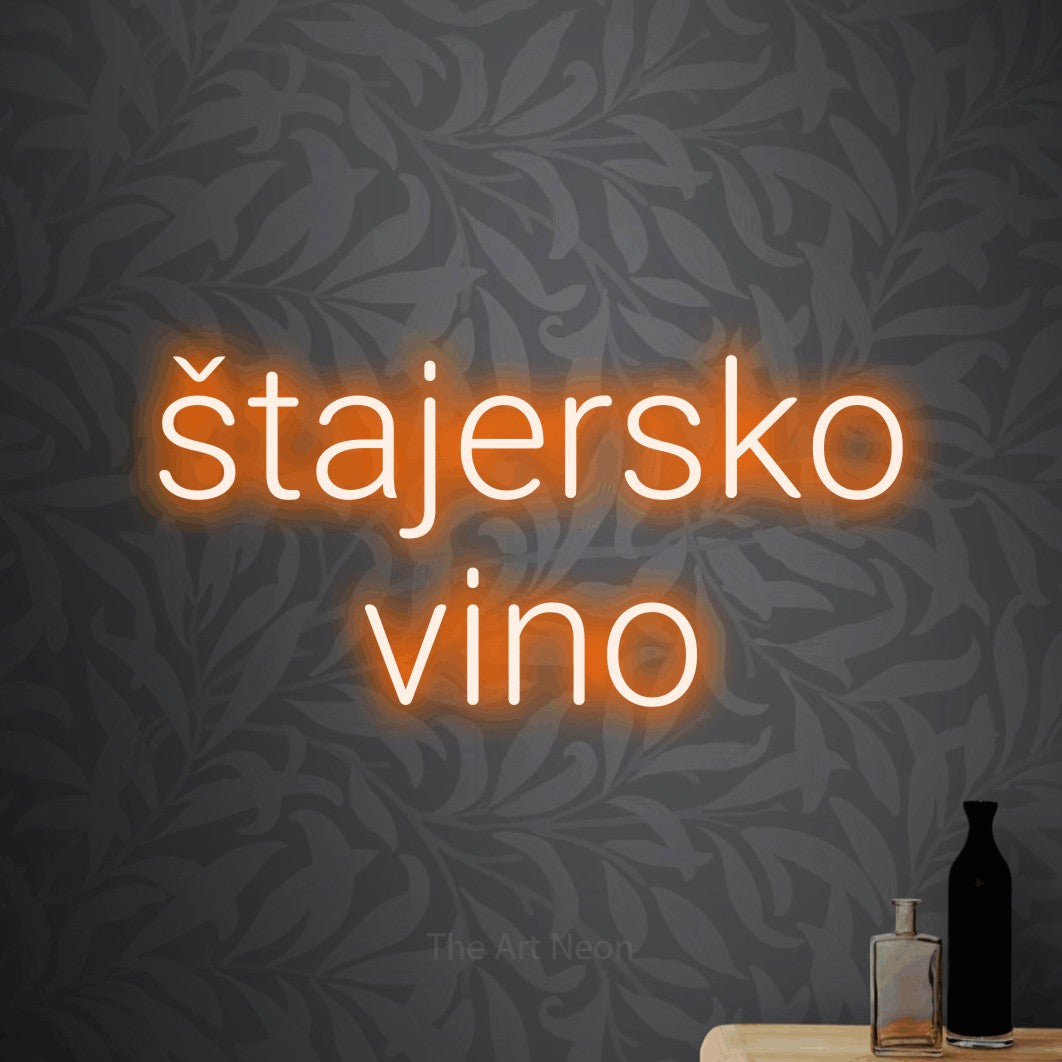 LED neon sign reading “štajersko vino”, arranged in two lines.