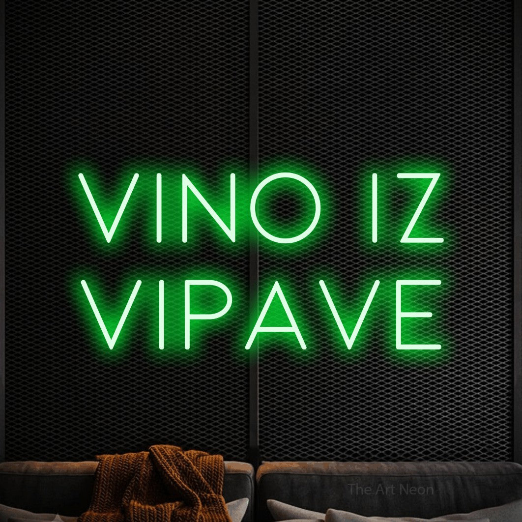 LED neon sign reading “VINO IZ VIPAVE”, arranged in two lines.