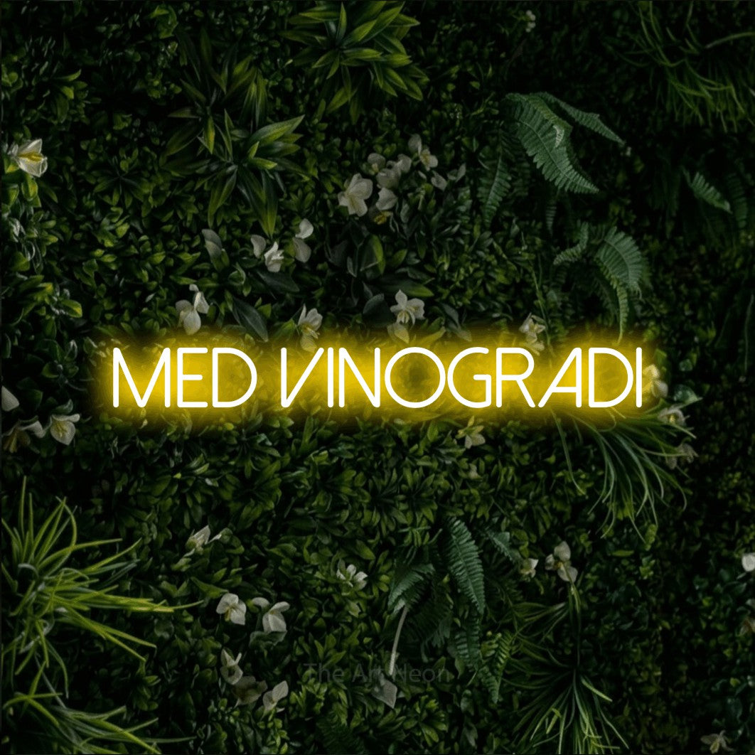 LED neon sign reading “med vinogradi”, arranged in a single line.