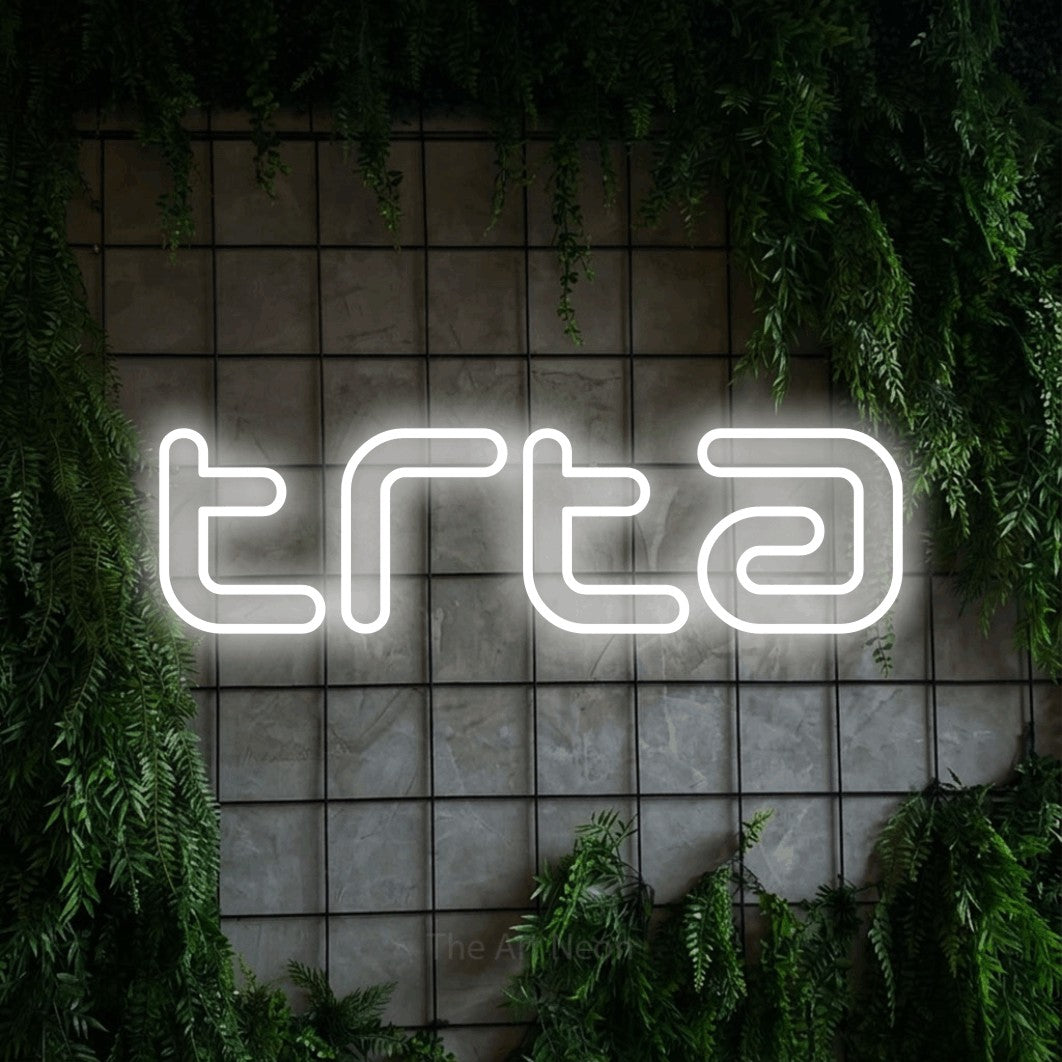 LED neon sign reading “trta”, arranged in a single line.