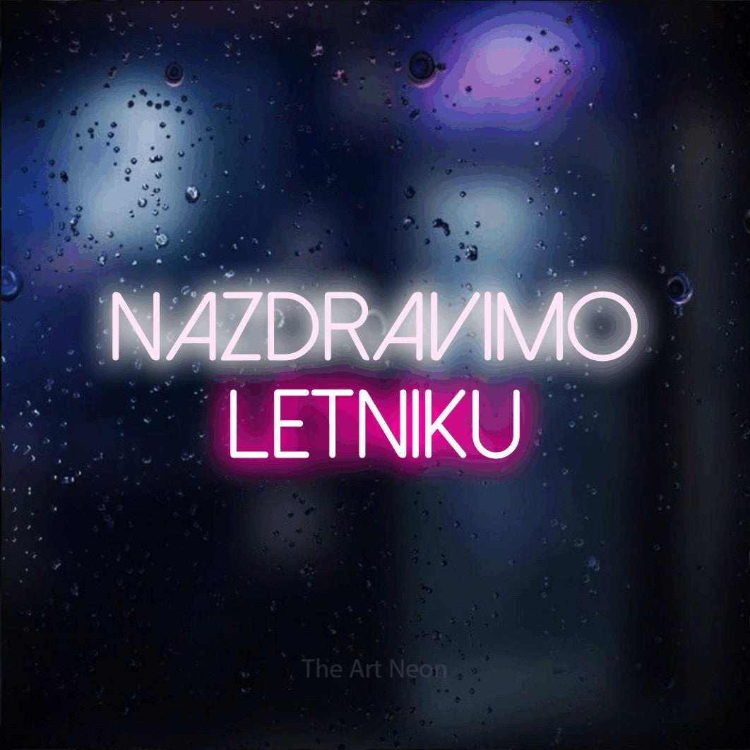 LED neon sign reading “NAZDRAVIMO LETNIKU”, arranged in two lines.