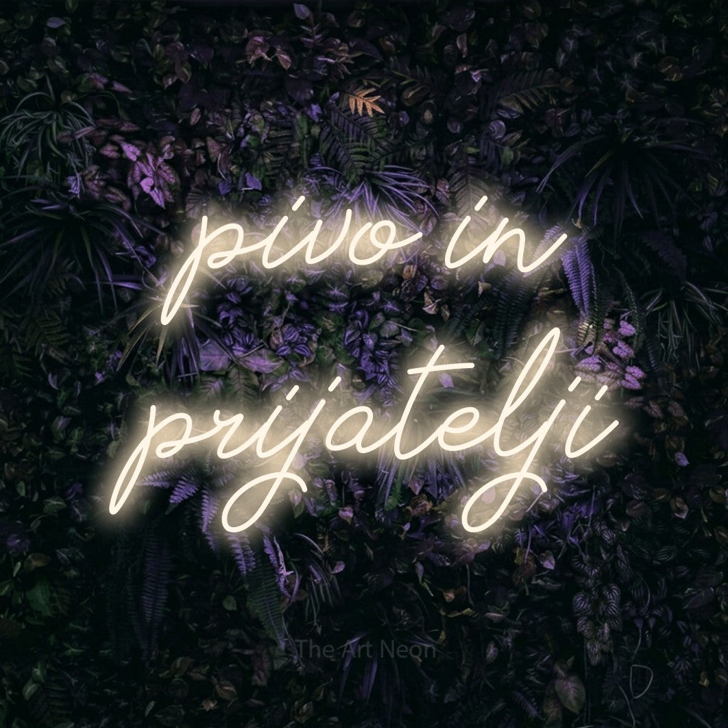 LED neon sign reading “pivo in prijatelji”, arranged in two lines.