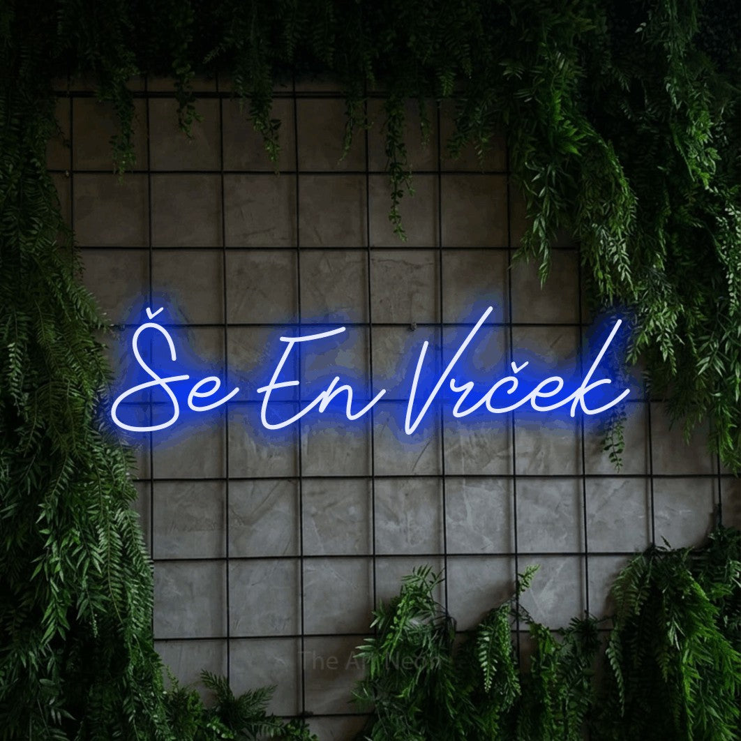 LED neon sign reading “Še En Vrček”, arranged in a single line.