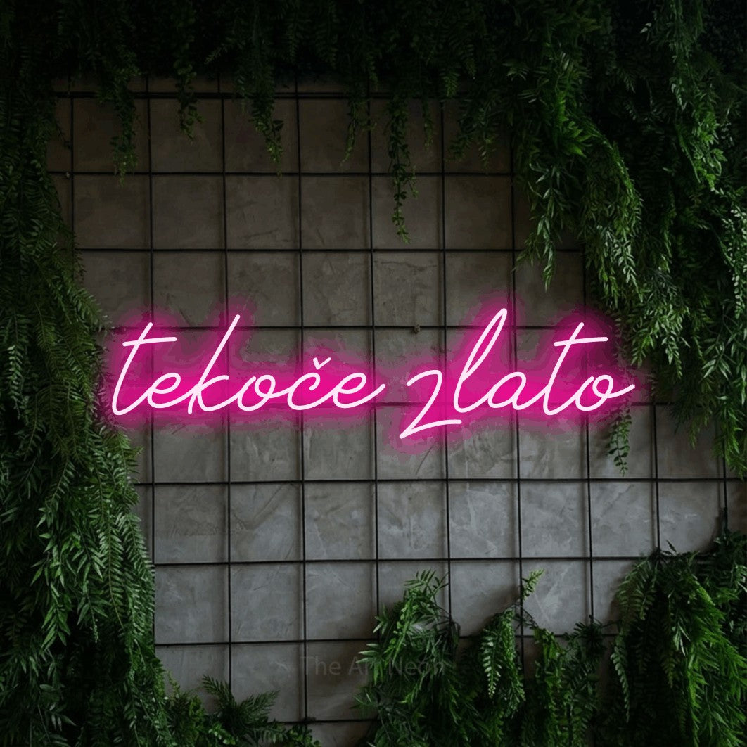 LED neon sign reading “tekoče zlato”, arranged in a single line.