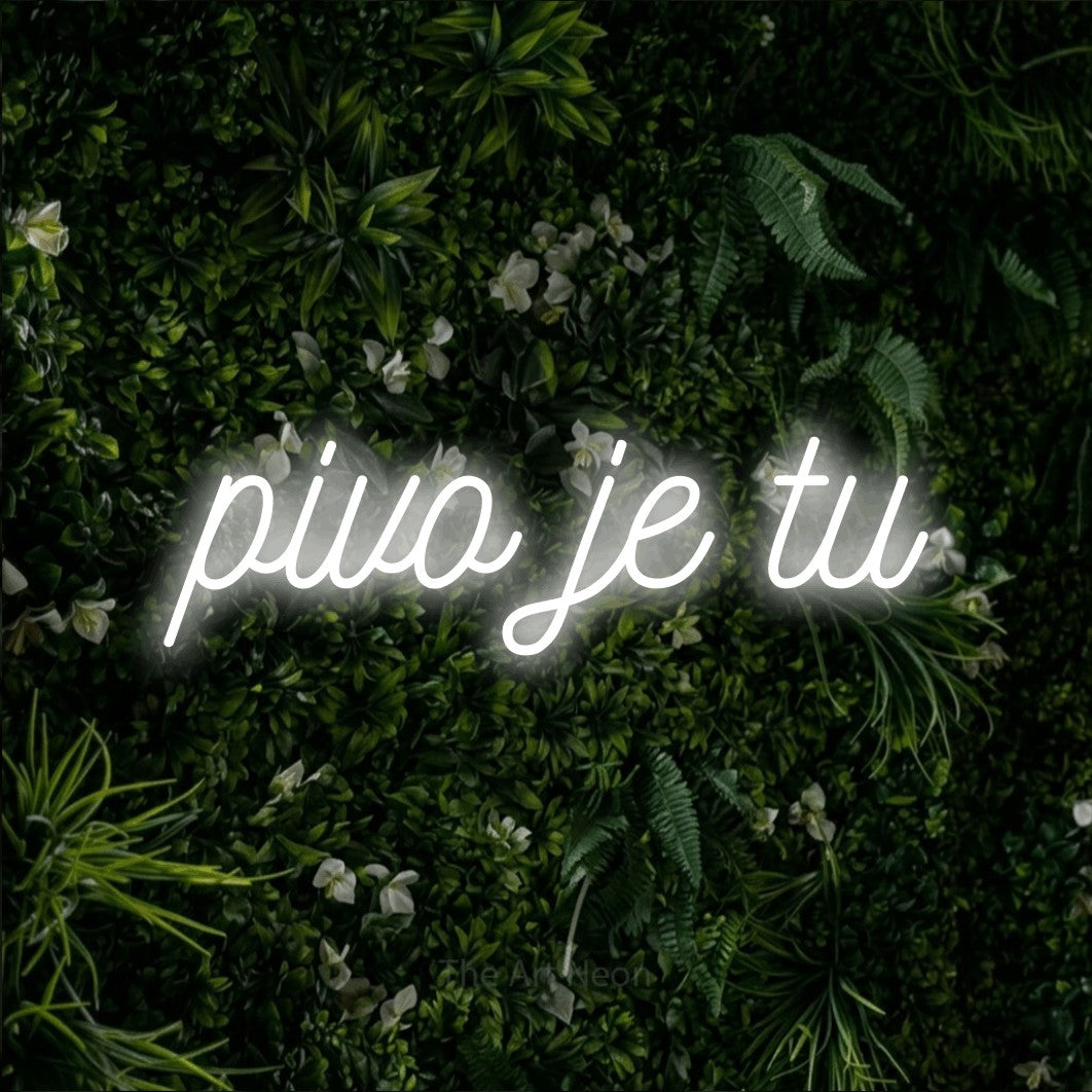 LED neon sign reading “pivo je tu”, arranged in a single line.