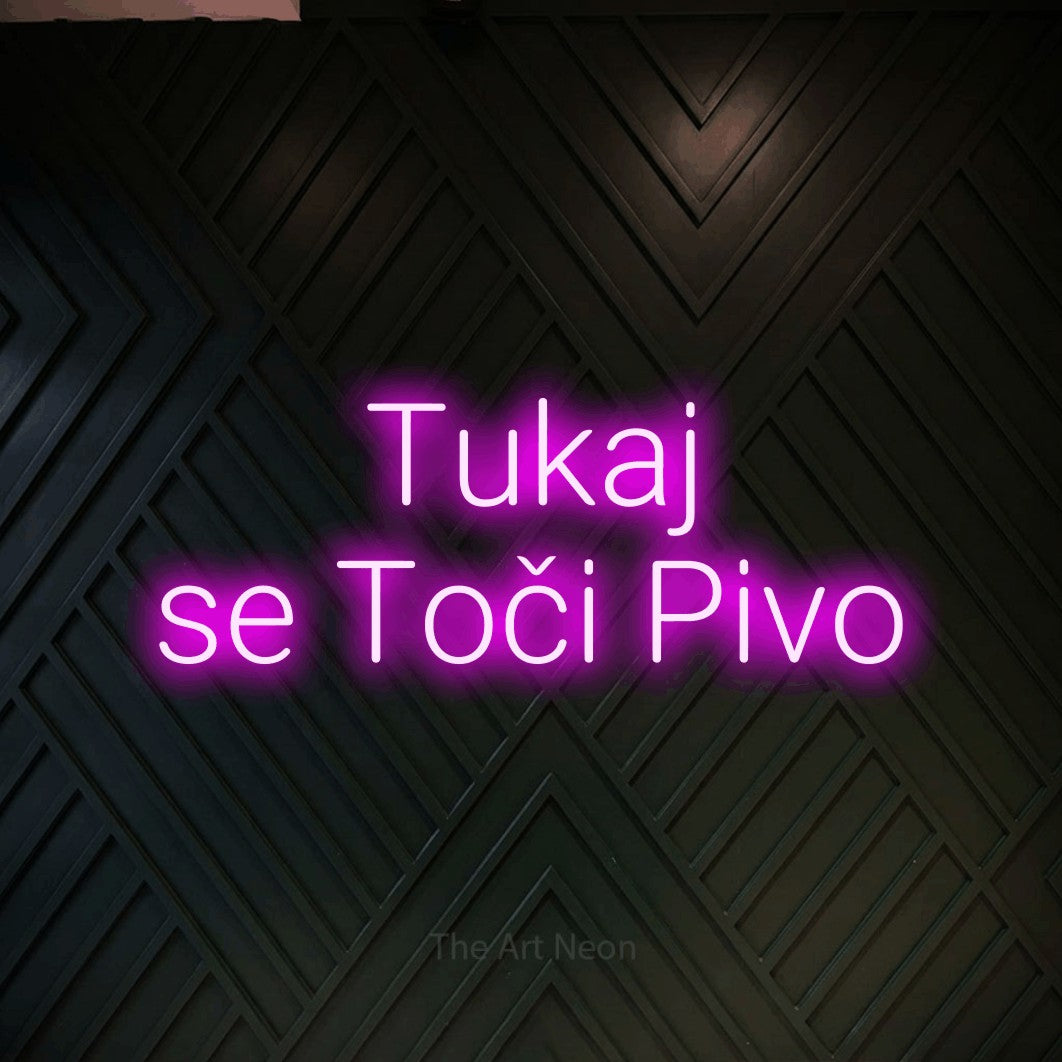LED neon sign reading “Tukaj se Toči Pivo”, arranged in two lines.