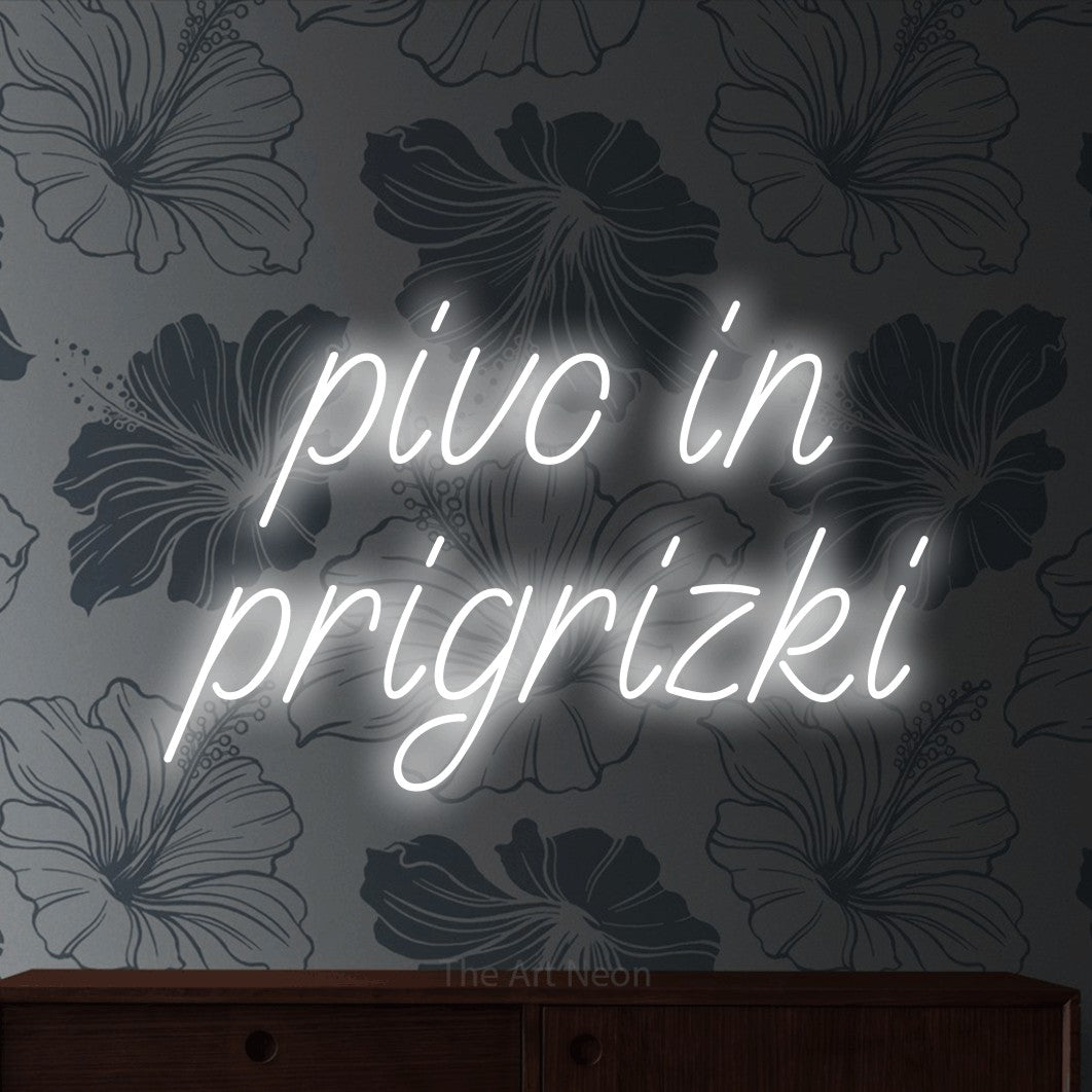 LED neon sign reading “pivo in prigrizki”, arranged in two lines.