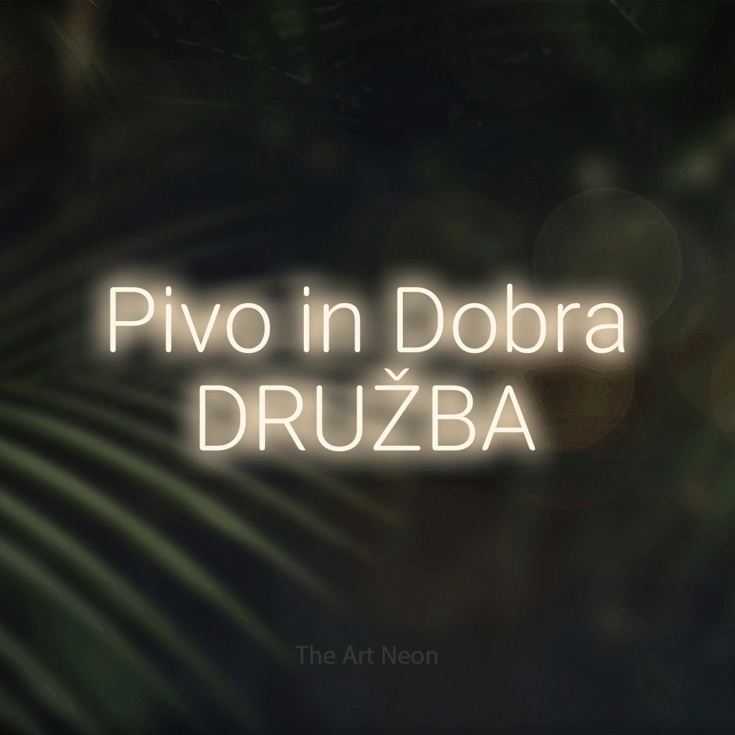 LED neon sign reading “Pivo in Dobra DRUŽBA”, arranged in two lines.