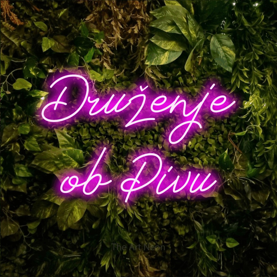 LED neon sign reading “Druženje ob Pivu”, arranged in two lines.