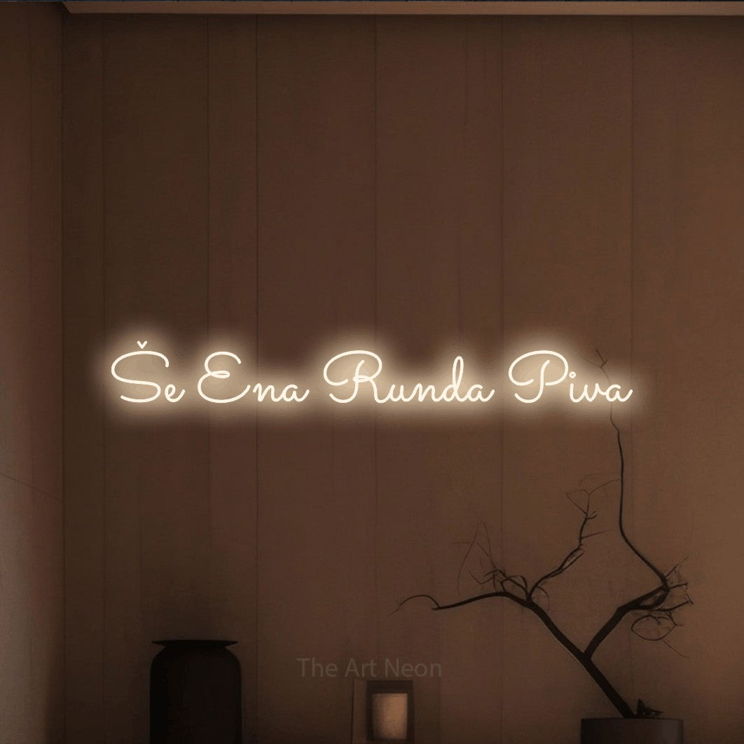 LED neon sign reading “Še Ena Runda Piva”, arranged in a single line.