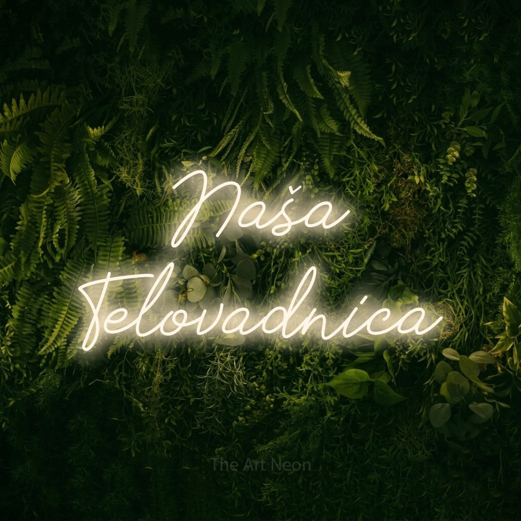 LED neon sign reading “Naša Telovadnica”, arranged in two lines.
