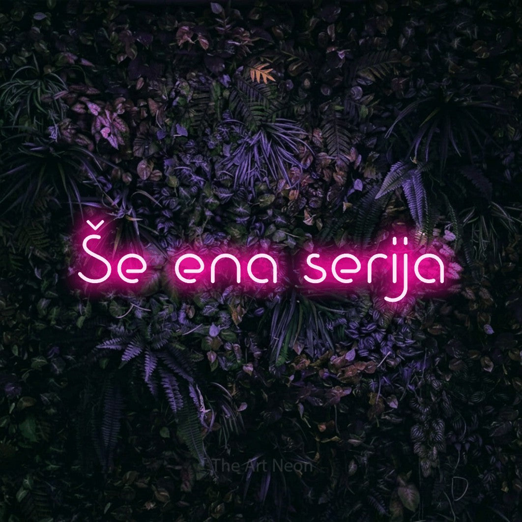 LED neon sign reading “Še ena serija”, arranged in a single line.
