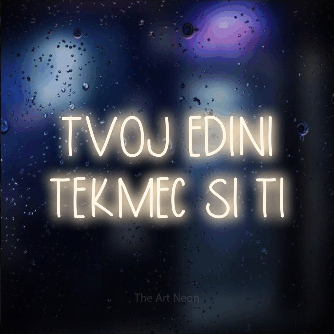 LED neon sign reading “TVOJ EDINI TEKMEC SI TI”, arranged in two lines.