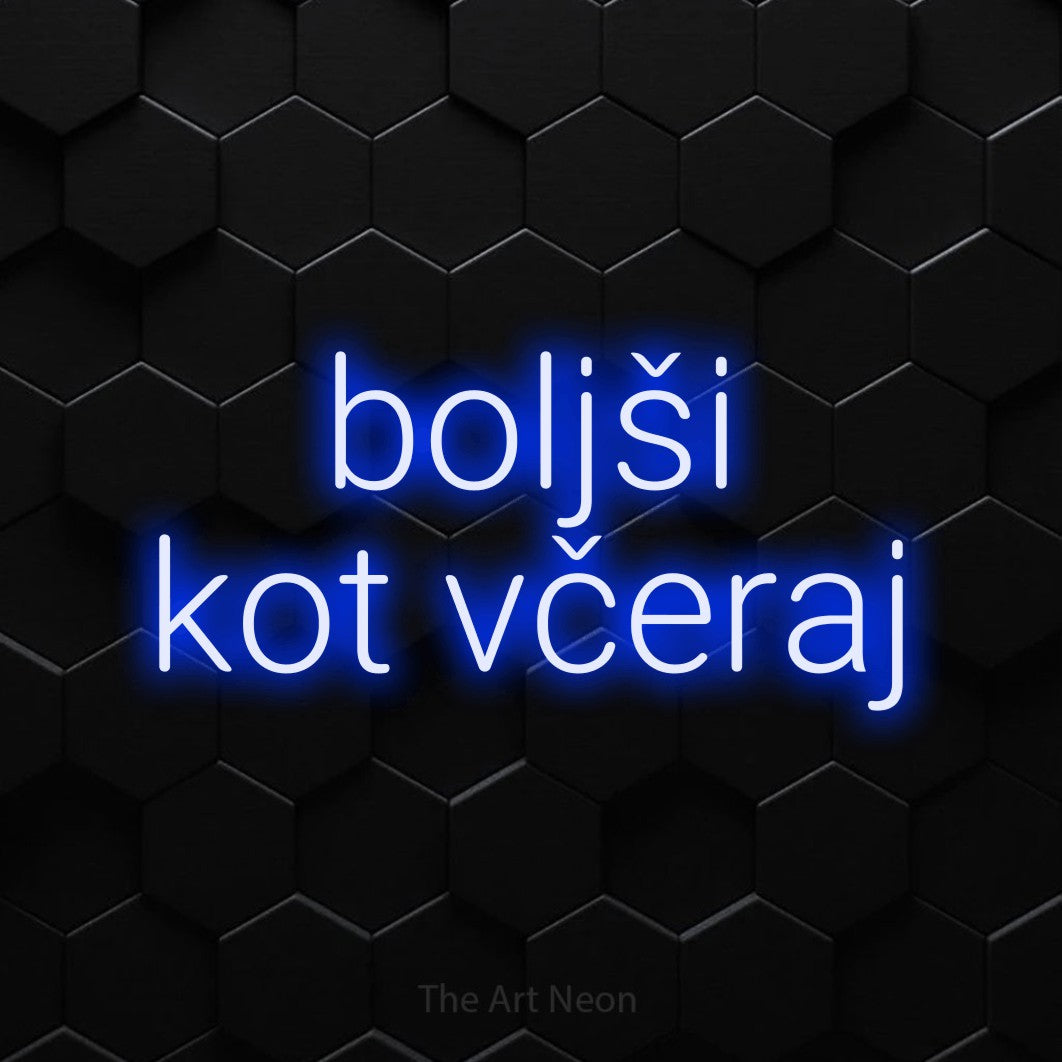 LED neon sign reading “boljši kot včeraj”, arranged in two lines.