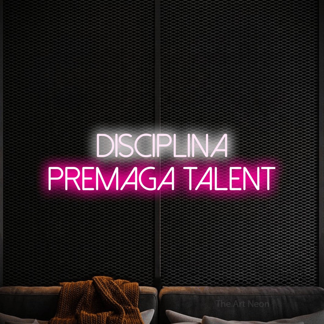 LED neon sign reading “Disciplina Premaga Talent”, arranged in two lines.