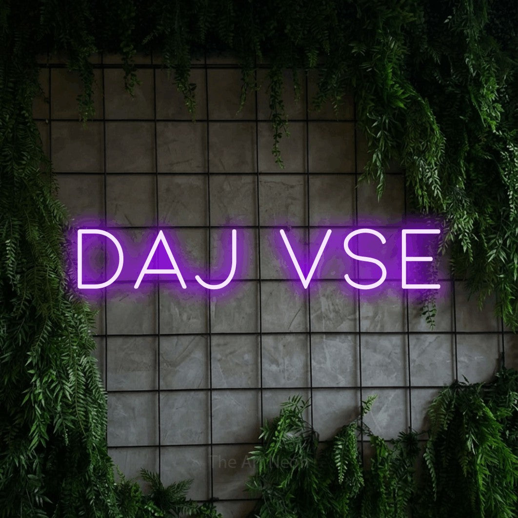 LED neon sign reading “daj vse”, arranged in a single line.
