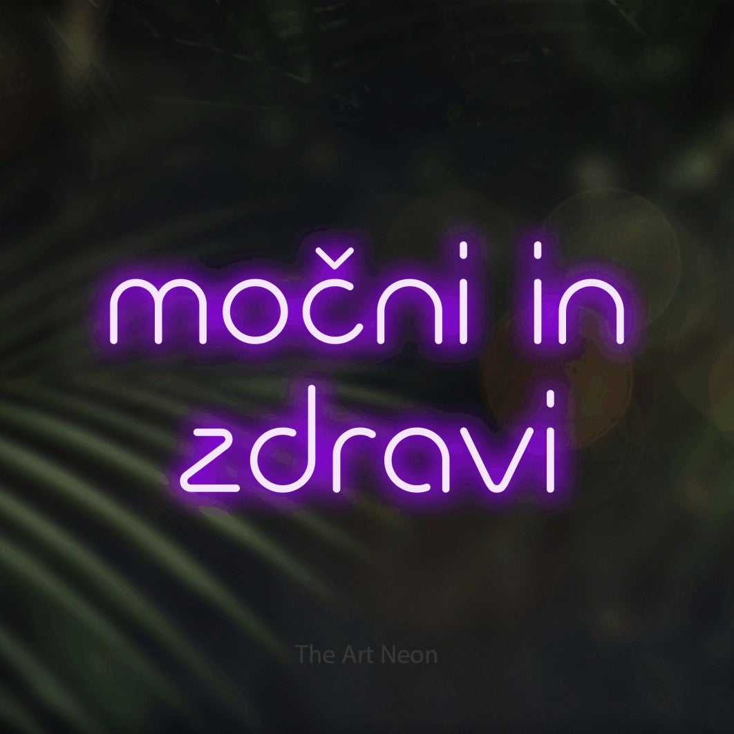LED neon sign reading “močni in zdravi”, arranged in two lines.