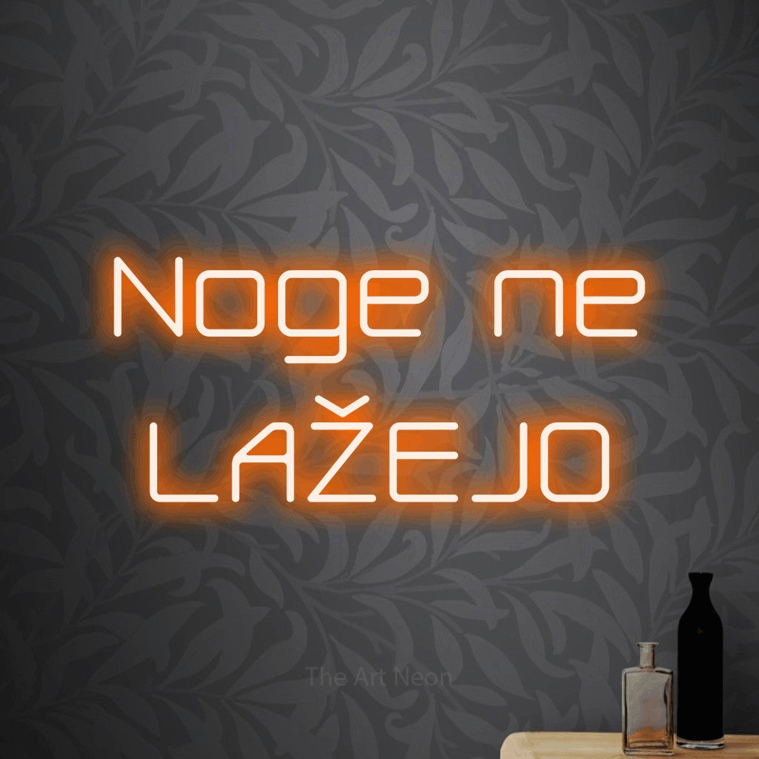 LED neon sign reading “Noge ne LAŽEJO”, arranged in two lines.