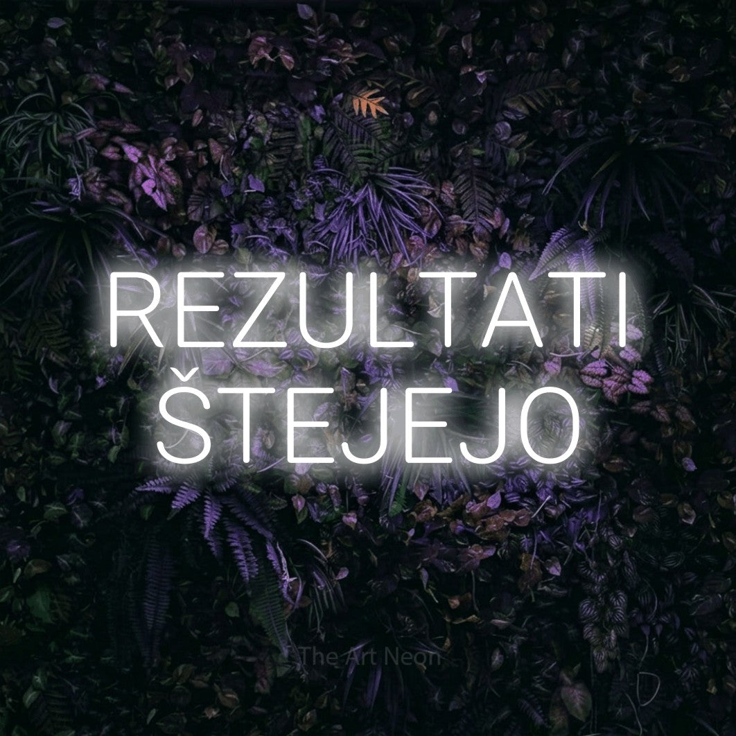 LED neon sign reading “REZULTATI ŠTEJEJO”, arranged in two lines.