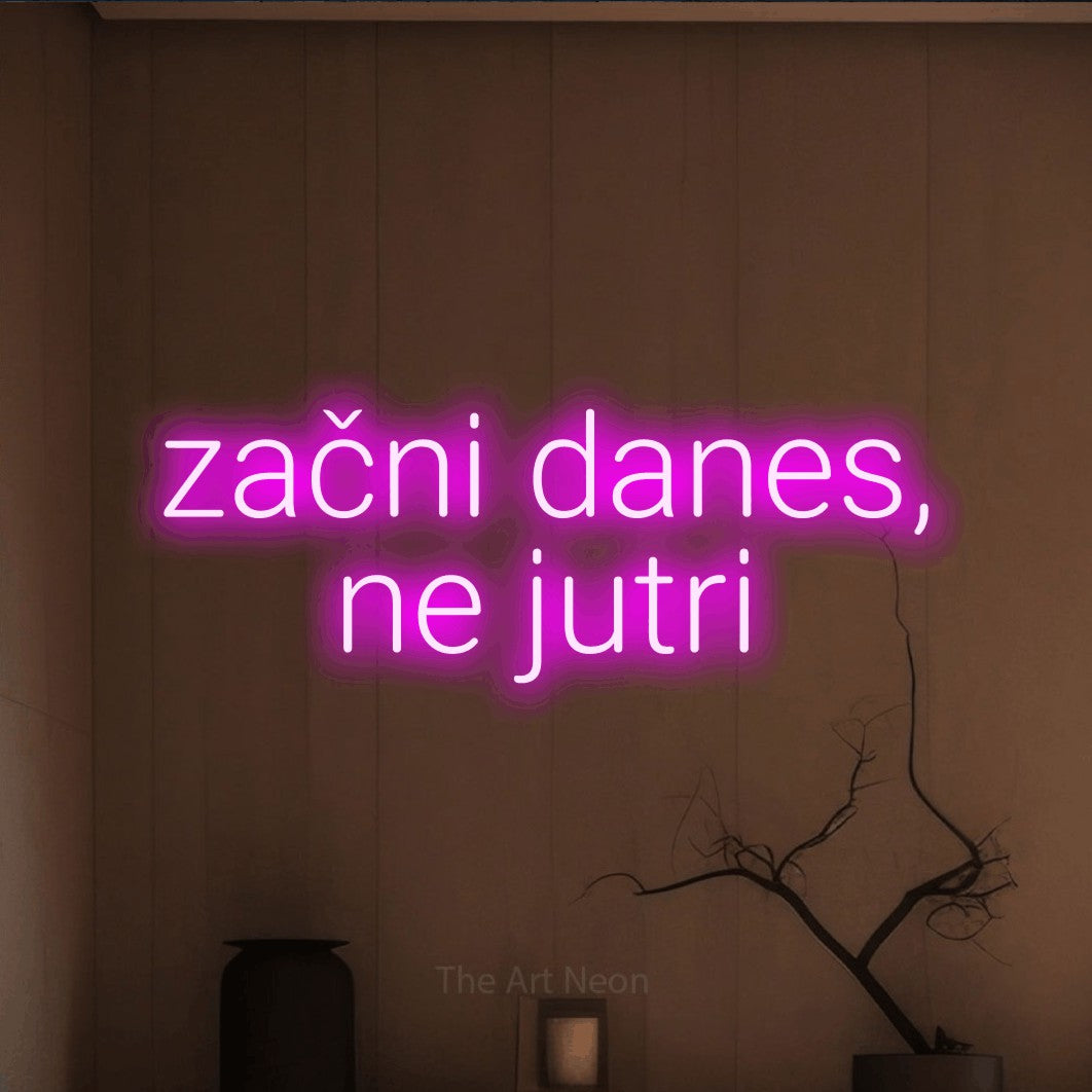 LED neon sign reading “začni danes, ne jutri”, arranged in two lines.
