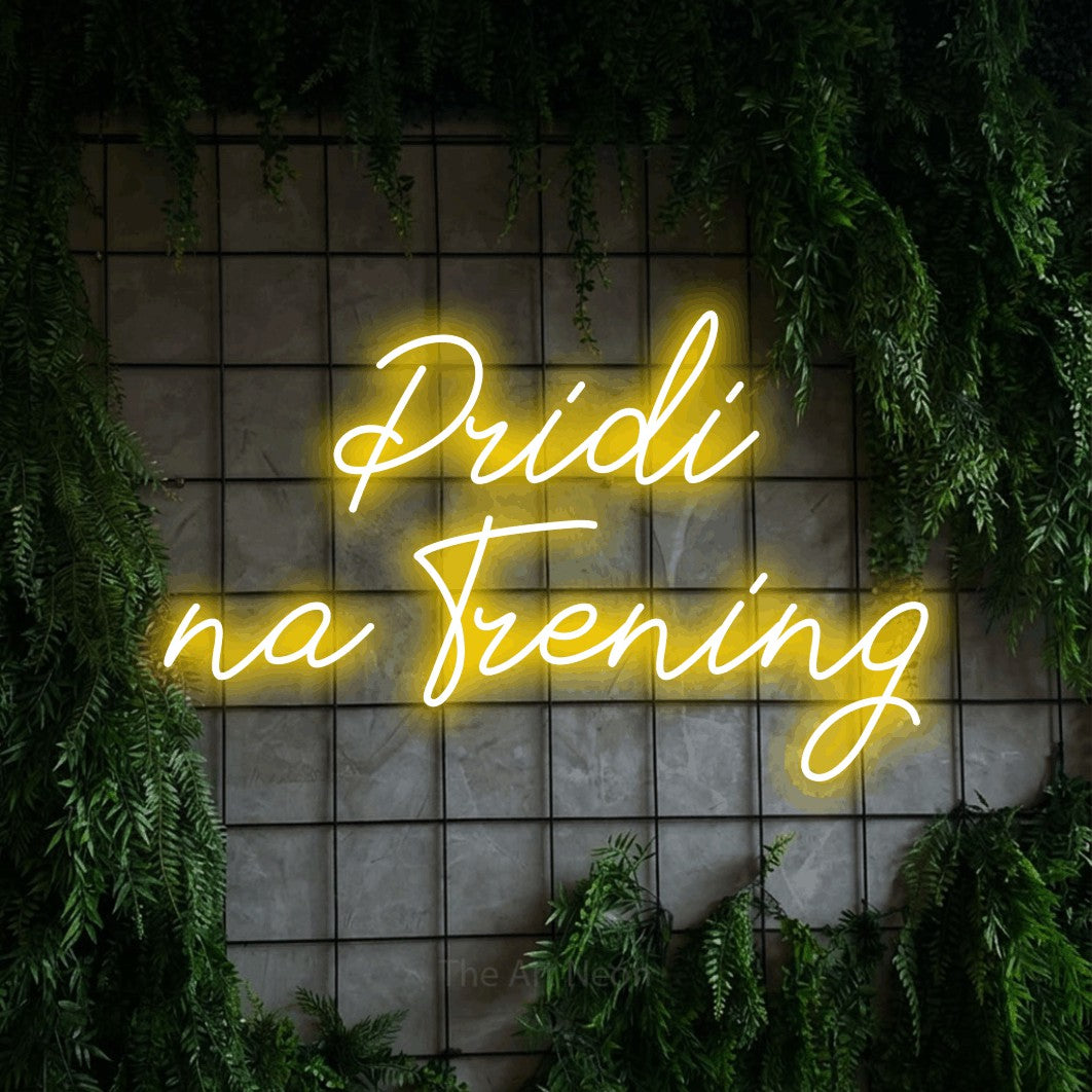LED neon sign reading “Pridi na Trening”, arranged in two lines.