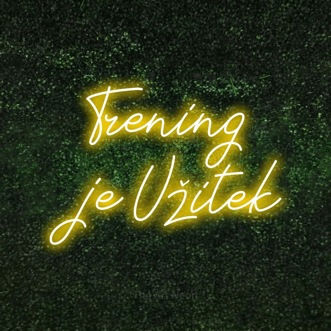 LED neon sign reading “Trening je Užitek”, arranged in two lines.
