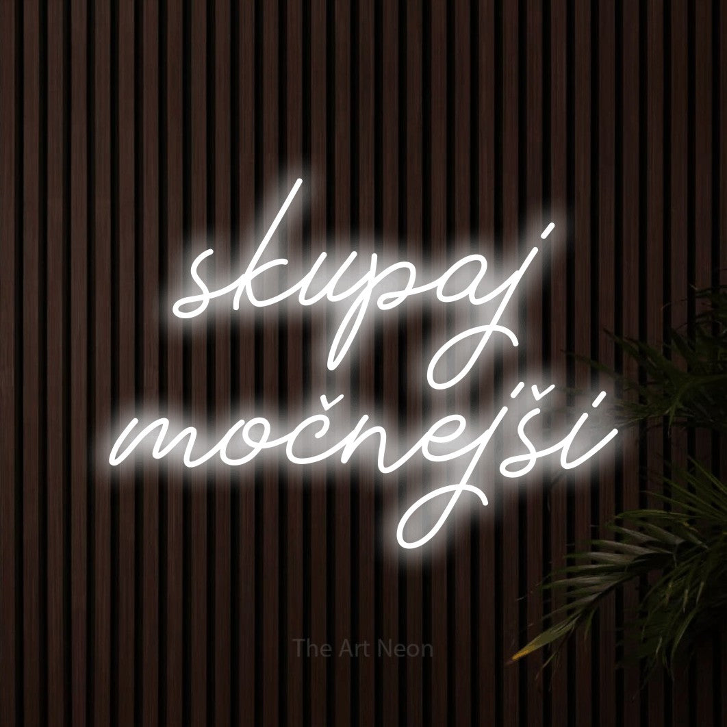 LED neon sign reading “skupaj močnejši”, arranged in two lines.