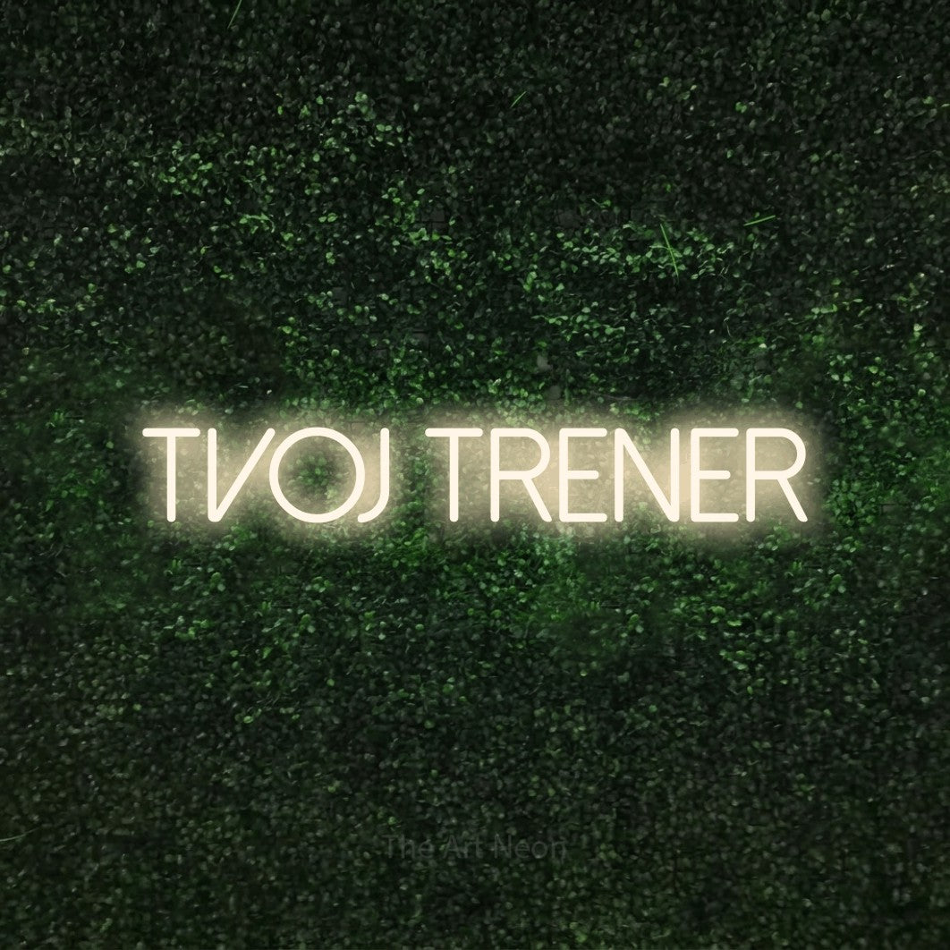 LED neon sign reading “Tvoj Trener”, arranged in a single line.