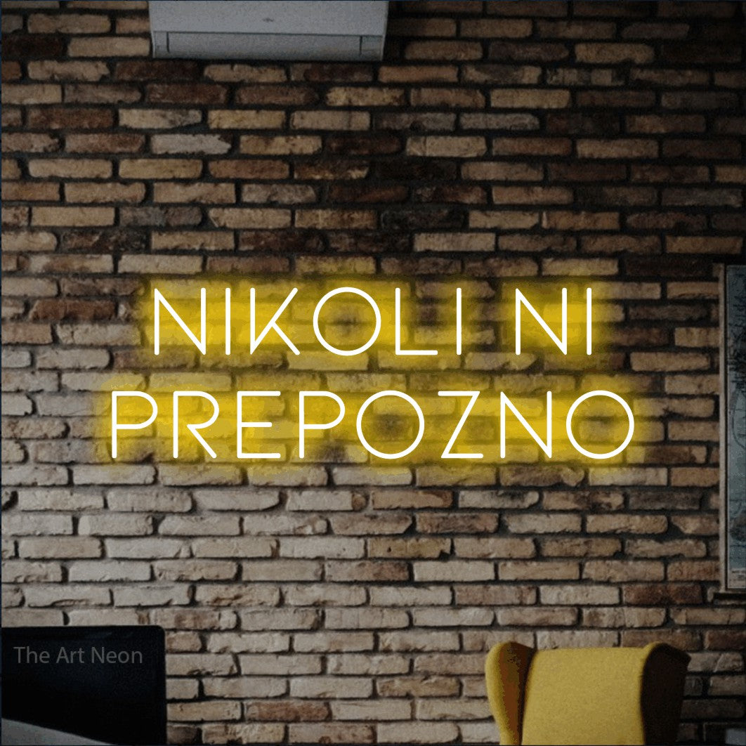 LED neon sign reading “NIKOLI NI PREPOZNO”, arranged in two lines.