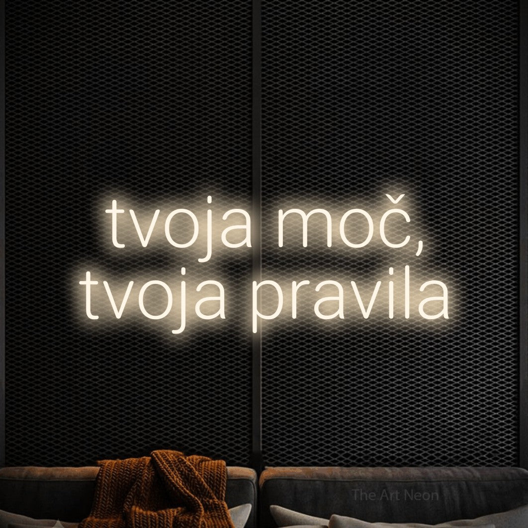 LED neon sign reading “tvoja moč, tvoja pravila”, arranged in two lines.