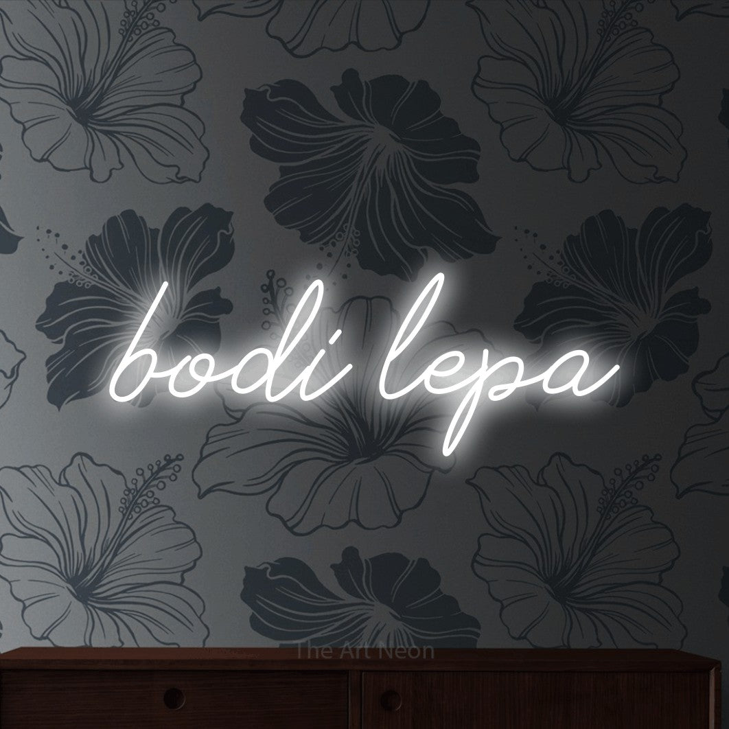 LED neon sign reading “bodi lepa”, arranged in a single line.