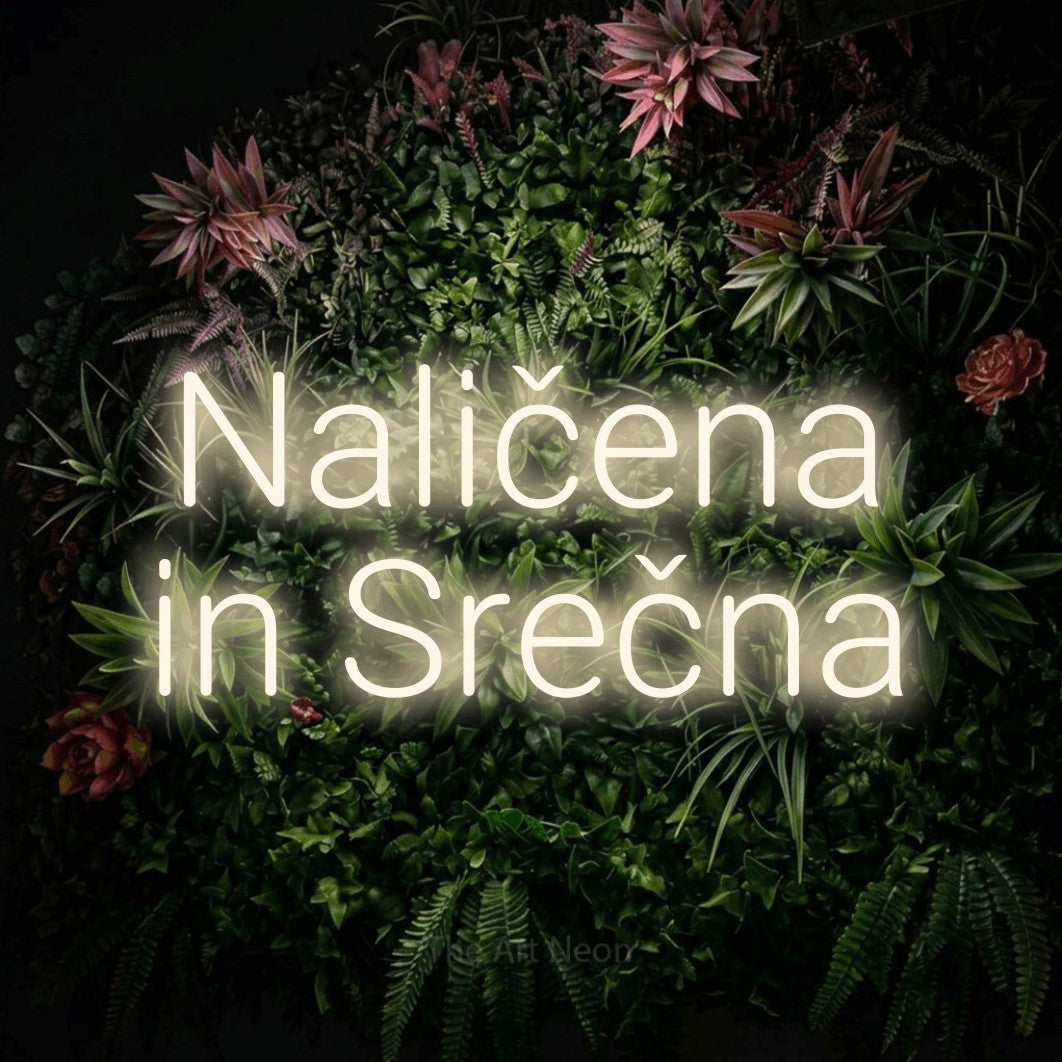 LED neon sign reading “Naličena in Srečna”, arranged in two lines.