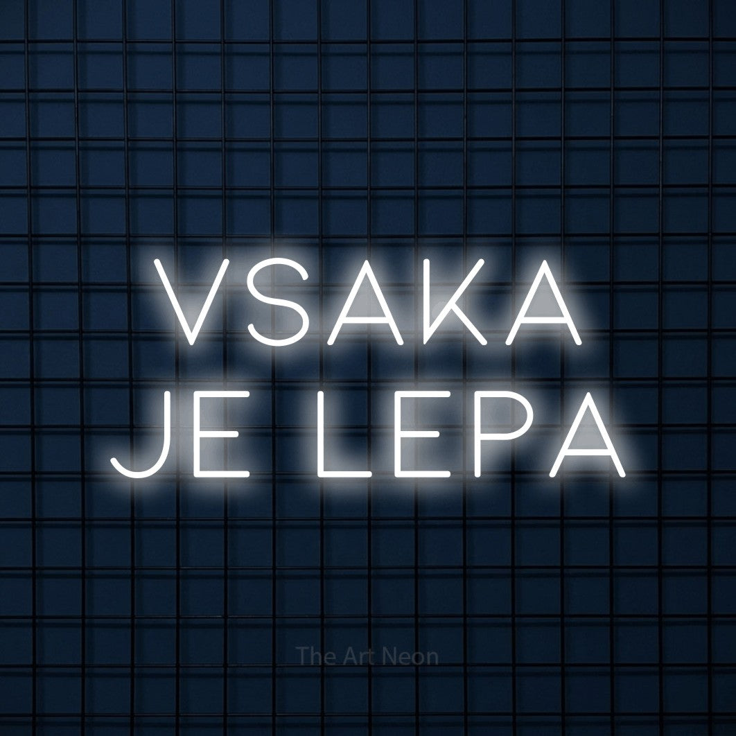 LED neon sign reading “vsaka je lepa”, arranged in two lines.