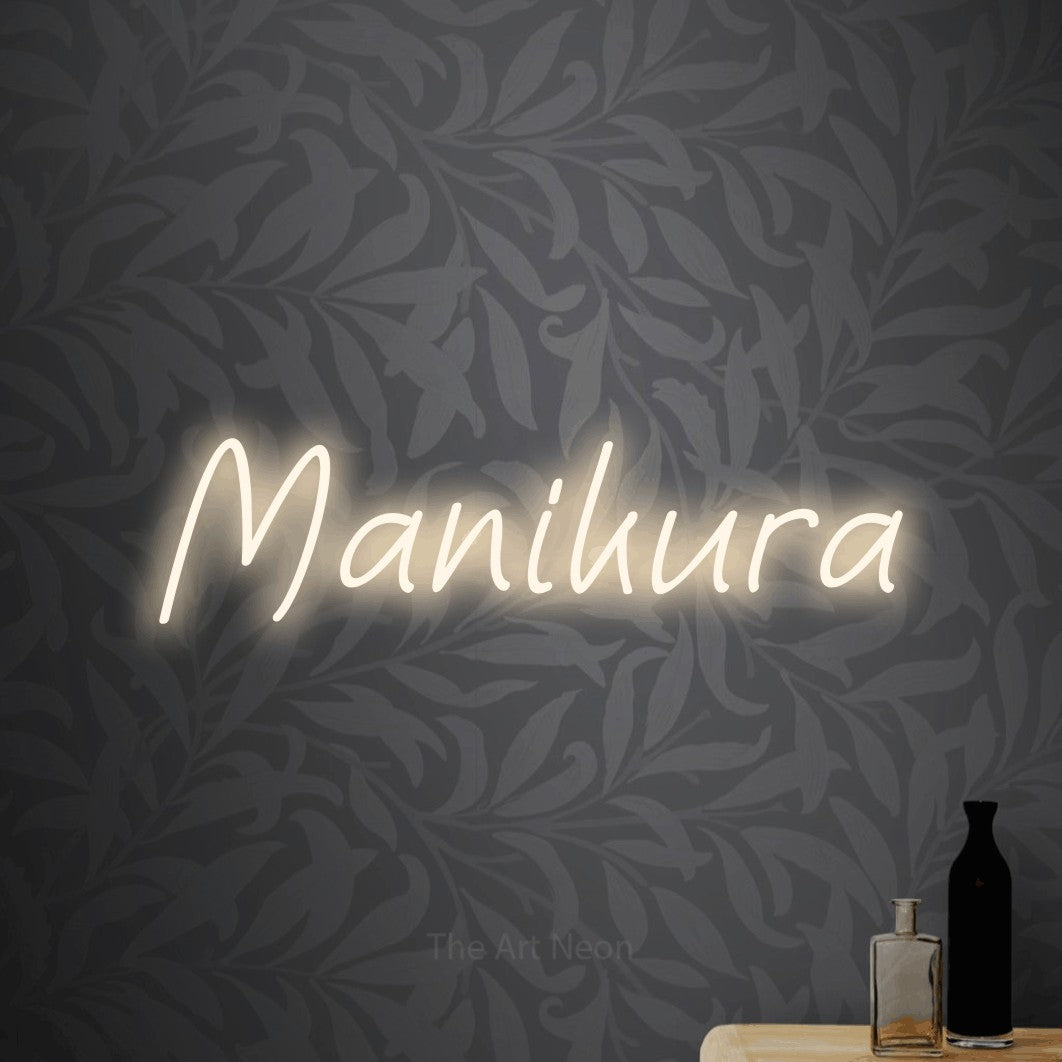 LED neon sign reading “Manikura”, arranged in a single line.