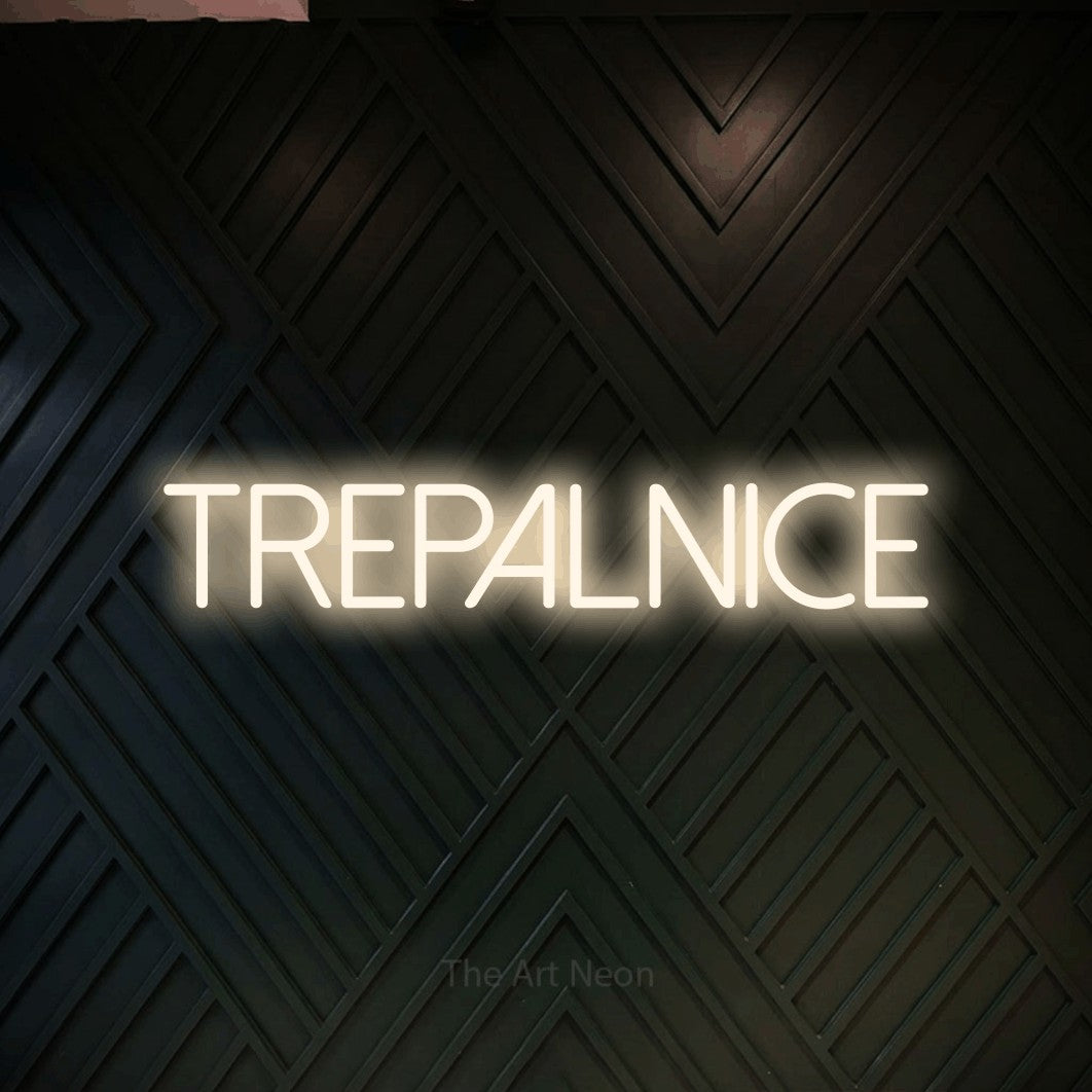 LED neon sign reading “TREPALNICE”, arranged in a single line.