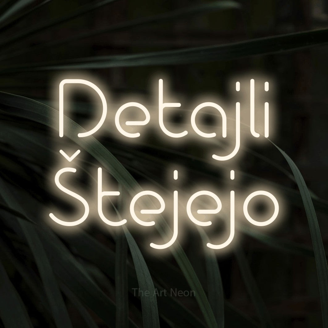 LED neon sign reading “Detajli Štejejo”, arranged in two lines.