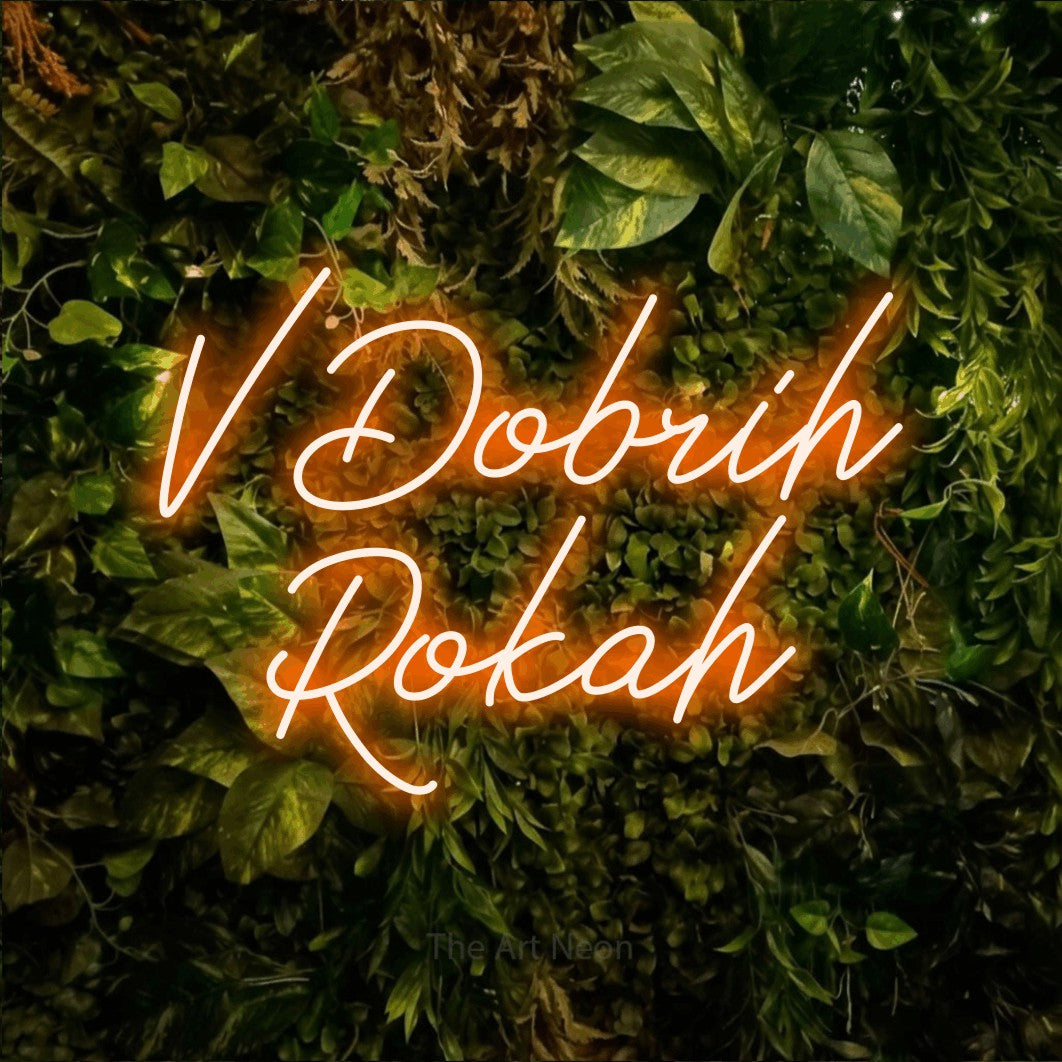 LED neon sign reading “V Dobrih Rokah”, arranged in two lines.