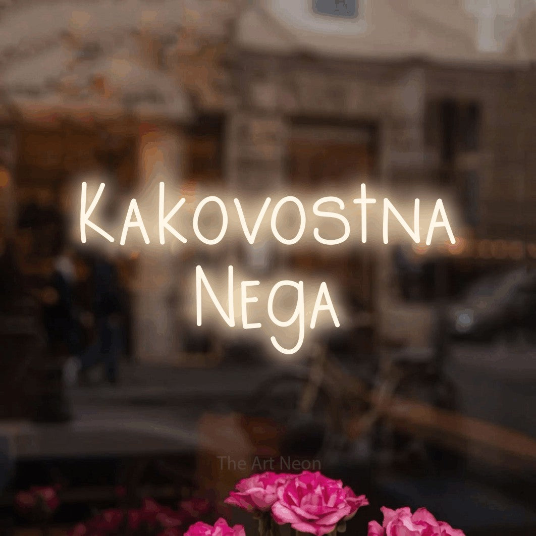 LED neon sign reading “Kakovostna Nega”, arranged in two lines.