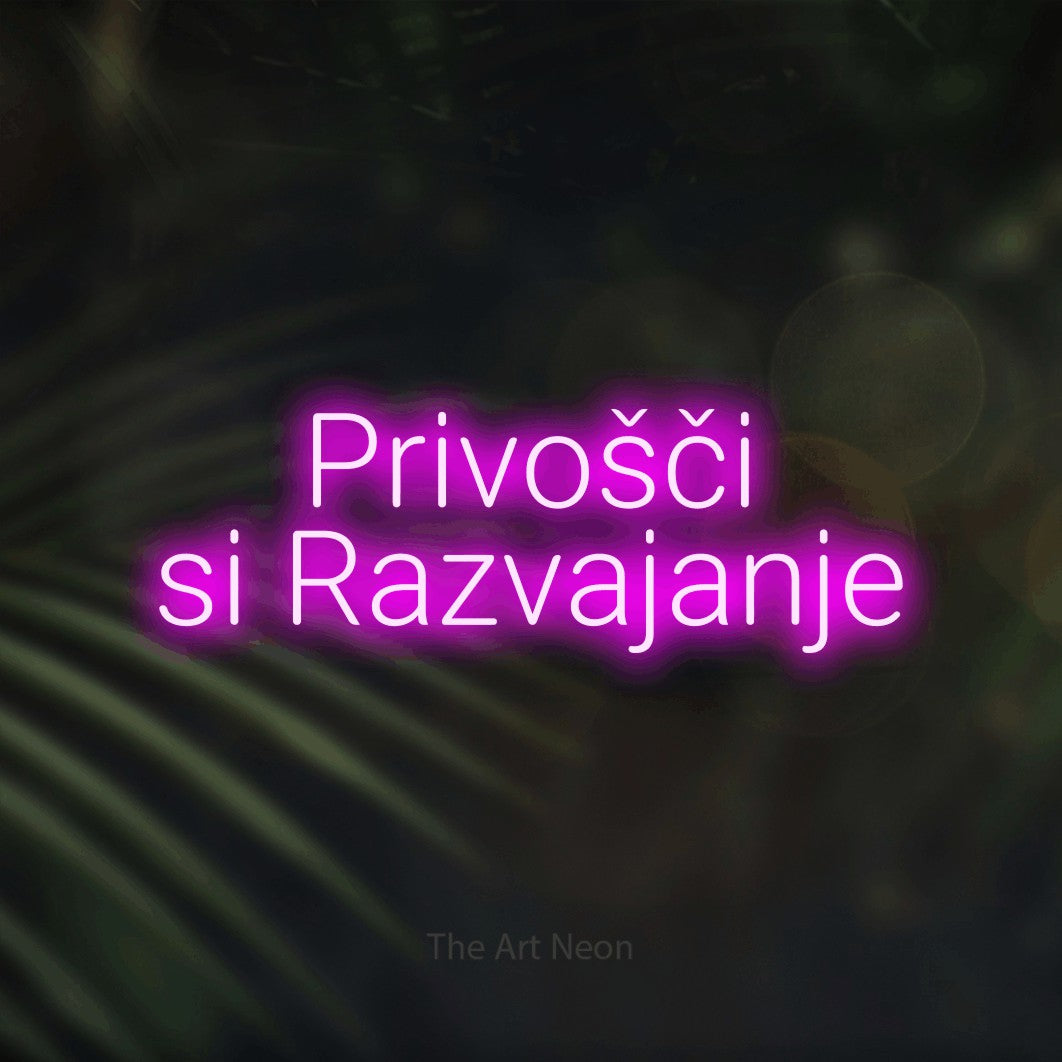 LED neon sign reading “Privošči si Razvajanje”, arranged in two lines.