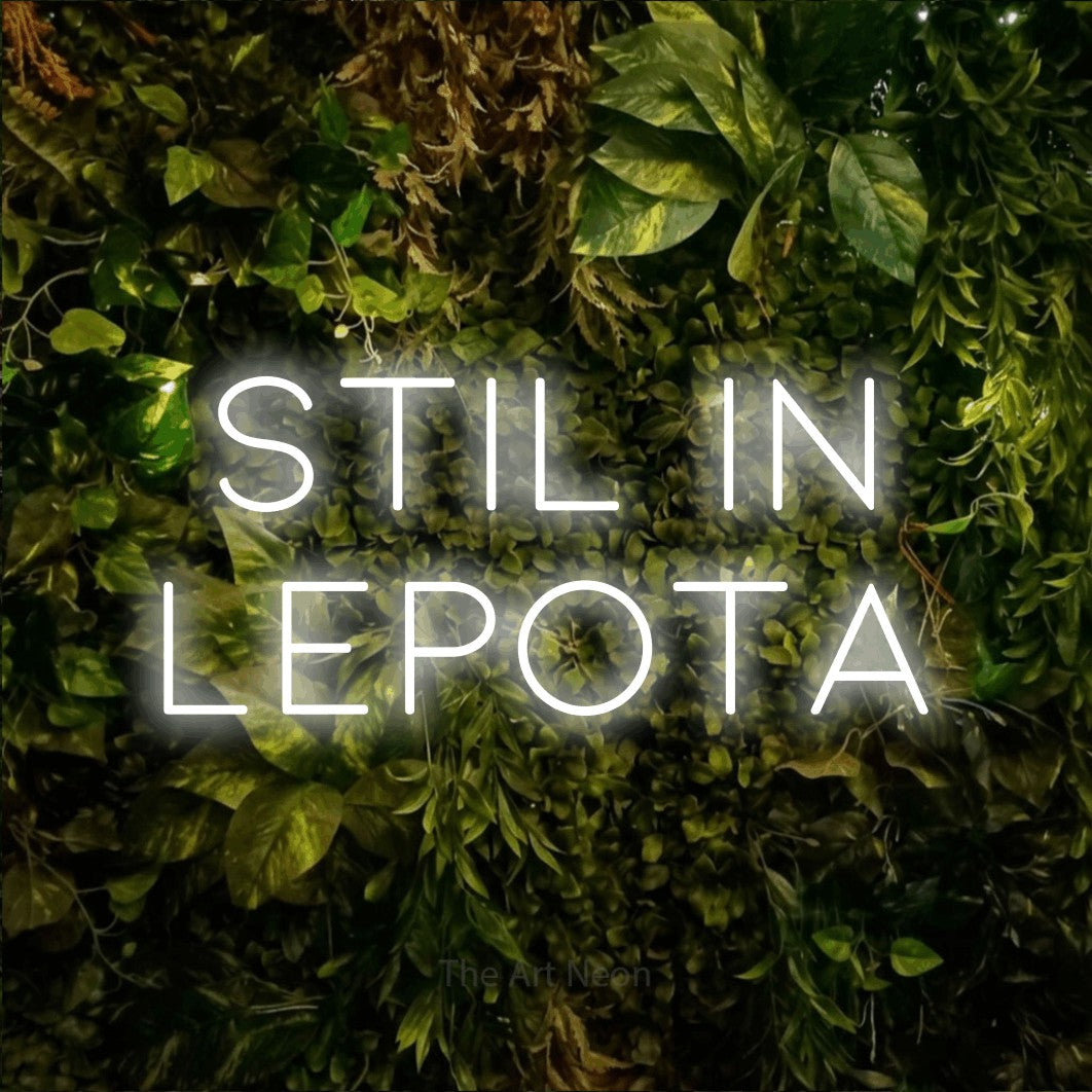 LED neon sign reading “Stil in Lepota”, arranged in two lines.