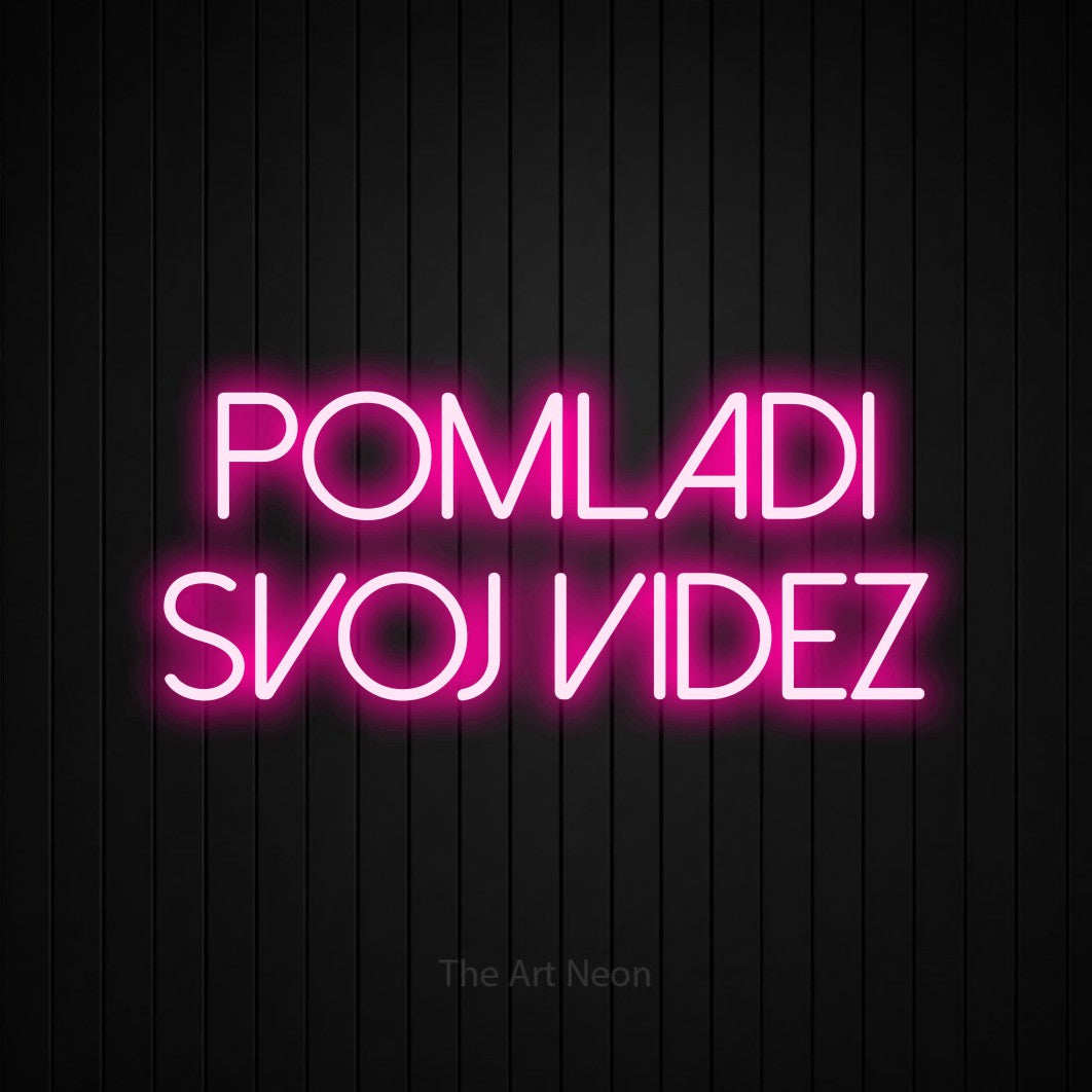 LED neon sign reading “pomladi svoj videz”, arranged in two lines.