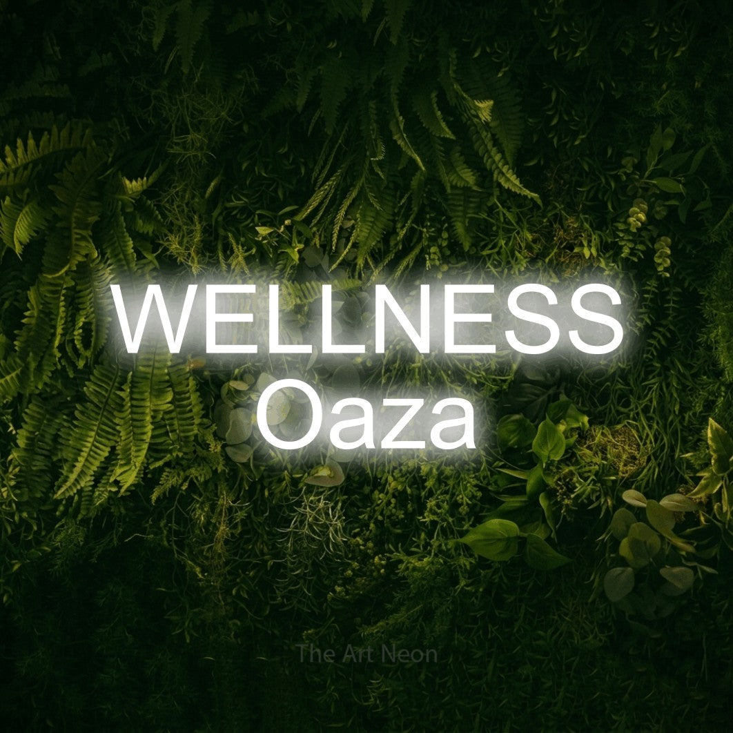 LED neon sign reading “WELLNESS Oaza”, arranged in two lines.