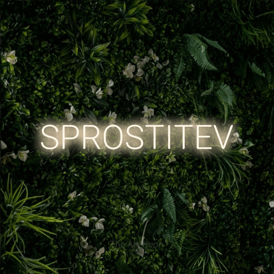 LED neon sign reading “SPROSTITEV”, arranged in a single line.