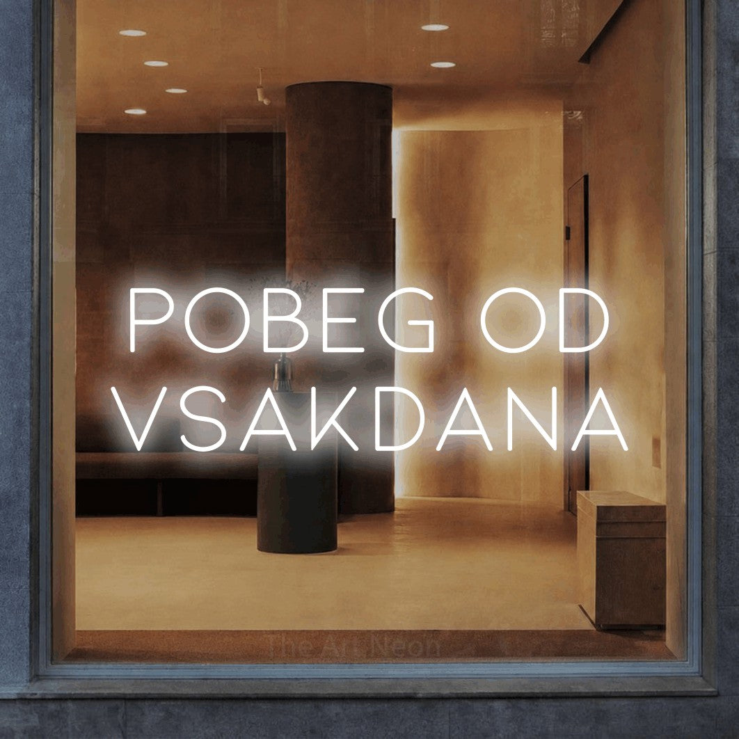 LED neon sign reading “Pobeg od VSAKDANA”, arranged in two lines.