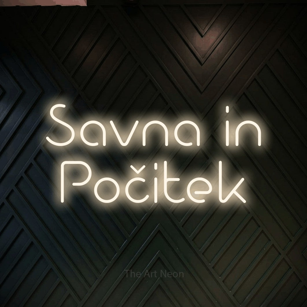 LED neon sign reading “Savna in Počitek”, arranged in two lines.