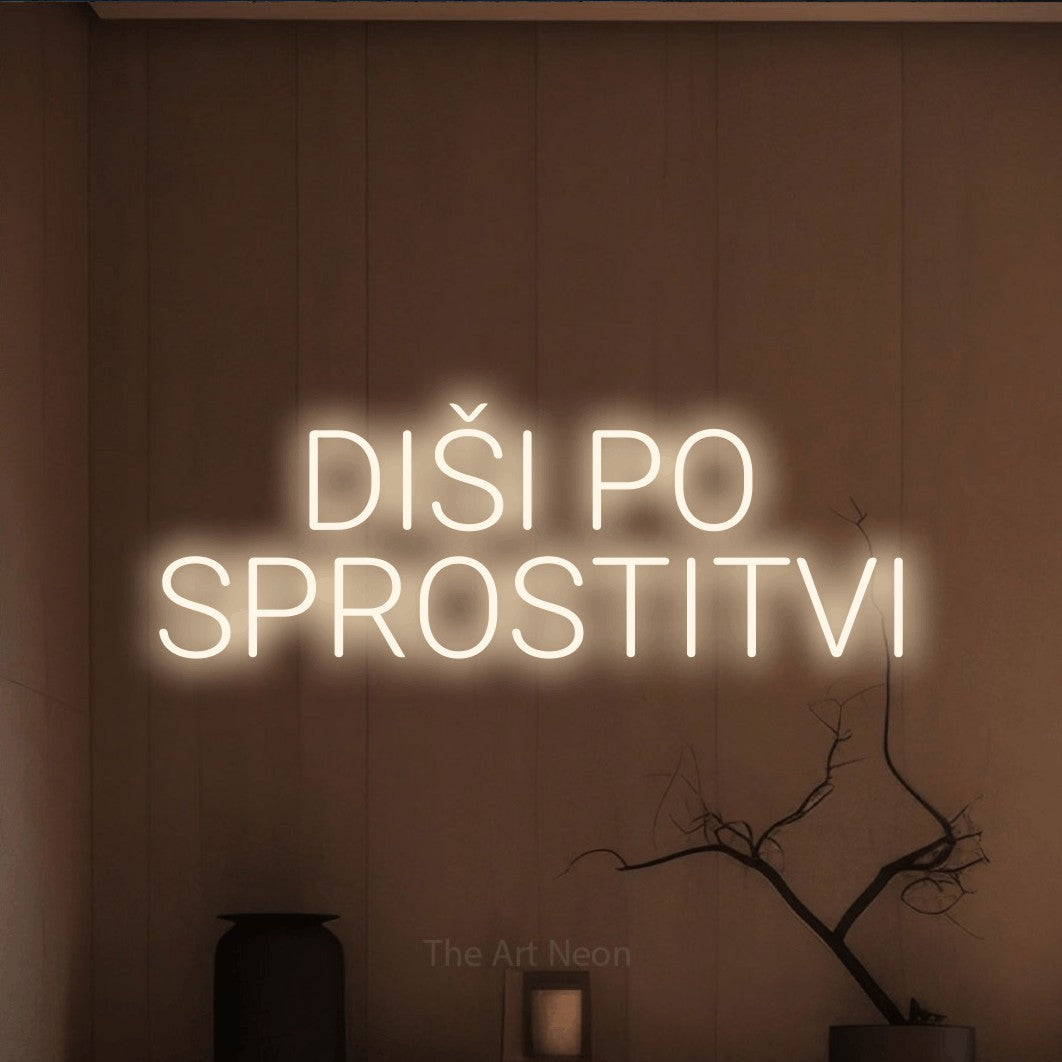 LED neon sign reading “DIŠI PO SPROSTITVI”, arranged in two lines.